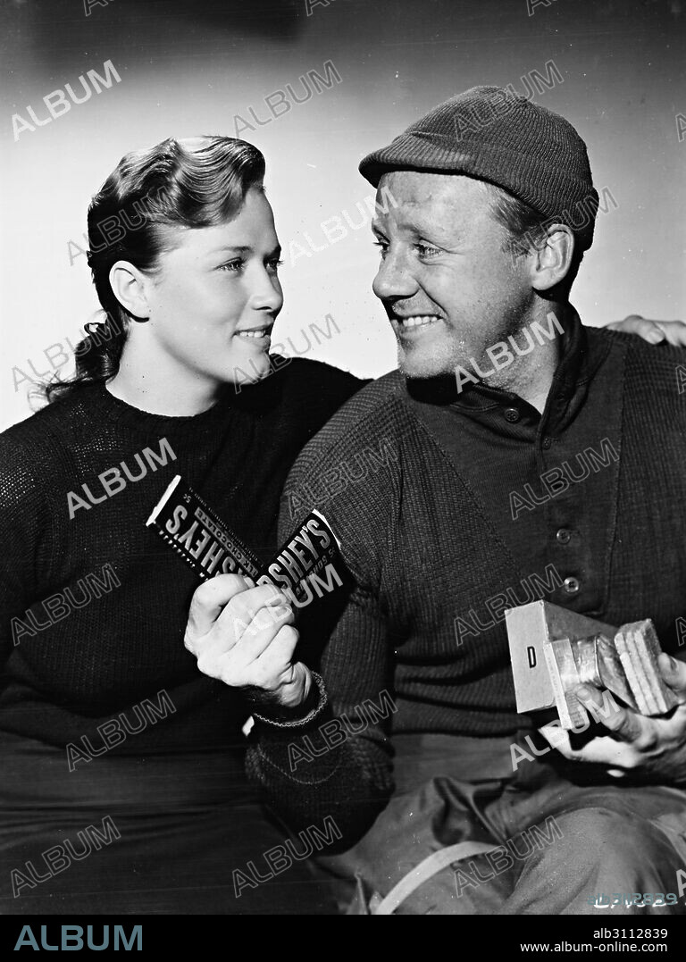 DENISE DARCEL and VAN JOHNSON in BATTLEGROUND, 1949, directed by WILLIAM A. WELLMAN. Copyright M.G.M.