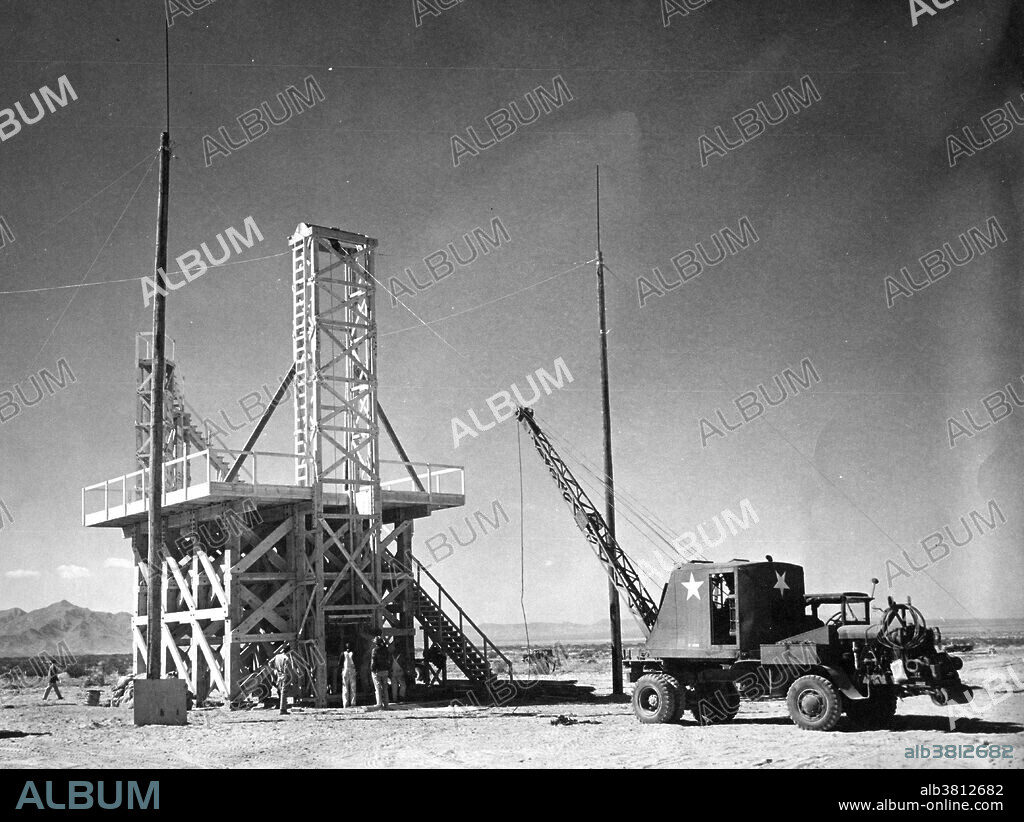 TNT Test Trinity. The Manhattan Project was a research and development program by the US with the UK and Canada that produced the first atomic bomb during WWII. From 1942-46, the project was under the direction of Major General Leslie Groves of the US Army Corps of Engineers. Because of the complexity of an implosion-style weapon, it was decided that an initial test would be required. Groves approved the test, subject to the active material being recovered. Consideration was therefore given to a controlled fizzle, but Oppenheimer opted instead for a full-scale nuclear test, codenamed Trinity. Bainbridge selected the bombing range near Alamogordo Army Airfield as the site for the test. A base camp was built to house staff. A one-hundred foot shot tower was designed and constructed at ground zero. Concrete bunkers to house cameras and other diagnostic equipment popped up in a rough circle around ground zero. A commitment had been made to test the gadget "as soon after July 15th as possible," and before or during the upcoming Potsdam Conference. TNT Trinity Test occured on July 16th.