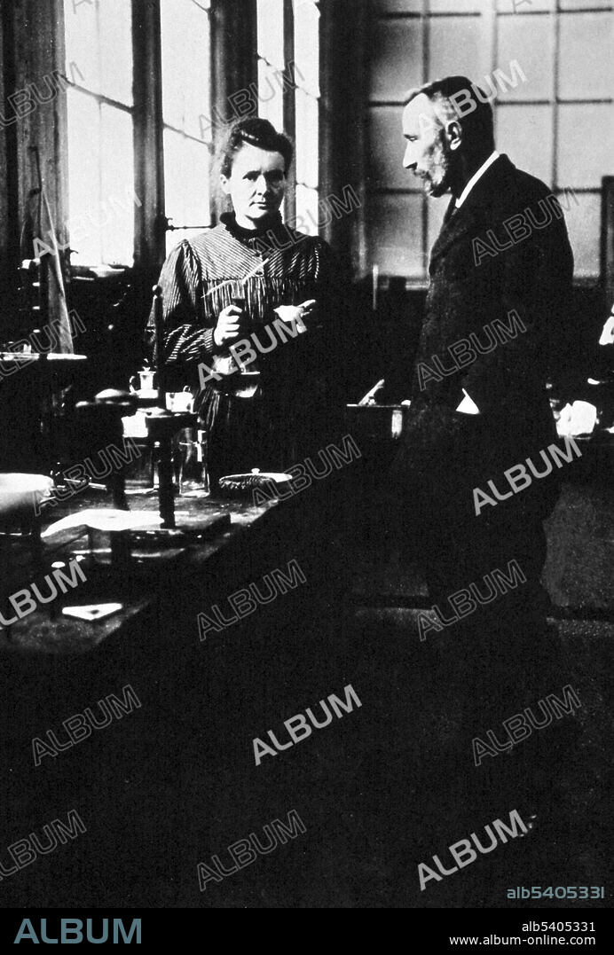 Marie and Pierre Curie in their laboratory in Paris. Pierre Curie was introduced to Maria Sklodowska by a friend and took Maria into his laboratory as his student. He began to regard her as his muse. She refused his initial proposal, but finally agreed to marry him on July 26, 1895. Marie Curie (November 7, 1867 - July 4, 1934) was a Polish-French physicist and chemist. She was the first woman to win a Nobel Prize, the only woman to date to win in two fields, and the only person to win in multiple sciences. Her achievements included a theory of radioactivity (a term that she coined), techniques for isolating radioactive isotopes, and the discovery of two elements, polonium and radium. Pierre Curie (May 15, 1859 -April 19, 1906) was a French physicist, a pioneer in crystallography, magnetism, piezoelectricity and radioactivity, and Nobel laureate. Pierre studied ferromagnetism, paramagnetism, and diamagnetism for his doctoral thesis, and discovered the effect of temperature on paramagnetism which is now known as Curie's law. The material constant in Curie's law is known as the Curie constant. No photographer credited, circa 1900s.