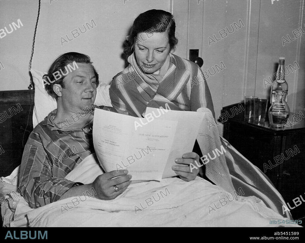 Famous Tenor. Rudolf Schock and his wife, anxious to improve their English, listen eagerly to the ABC's session, "English for New Australian." Schock opens his Australian season next Saturday night with Rafael Kubelik and the Sydney Symphony Orchestra. He will also give recitals on June 13, 15, 18 and 20. June 07, 1949. (Photo by Visatone (Aust.) Pty. Ltd.).