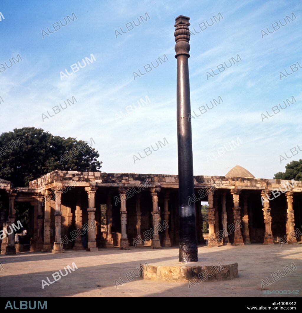 Asoka Pillar. Delhi, c20th century. The pillars of Ashoka are a series of columns dispersed throughout India, erected or at least inscribed with edicts by the Mauryan king Ashoka during his reign in the 3rd century BC. The iron pillar of Delhi  originally dedicated as dhvaja (banner) to Hindu deity lord Vishnu in 3rd to 4th century CE by king Chandra, currently standing in the Qutb complex at Mehrauli in Delhi, India.