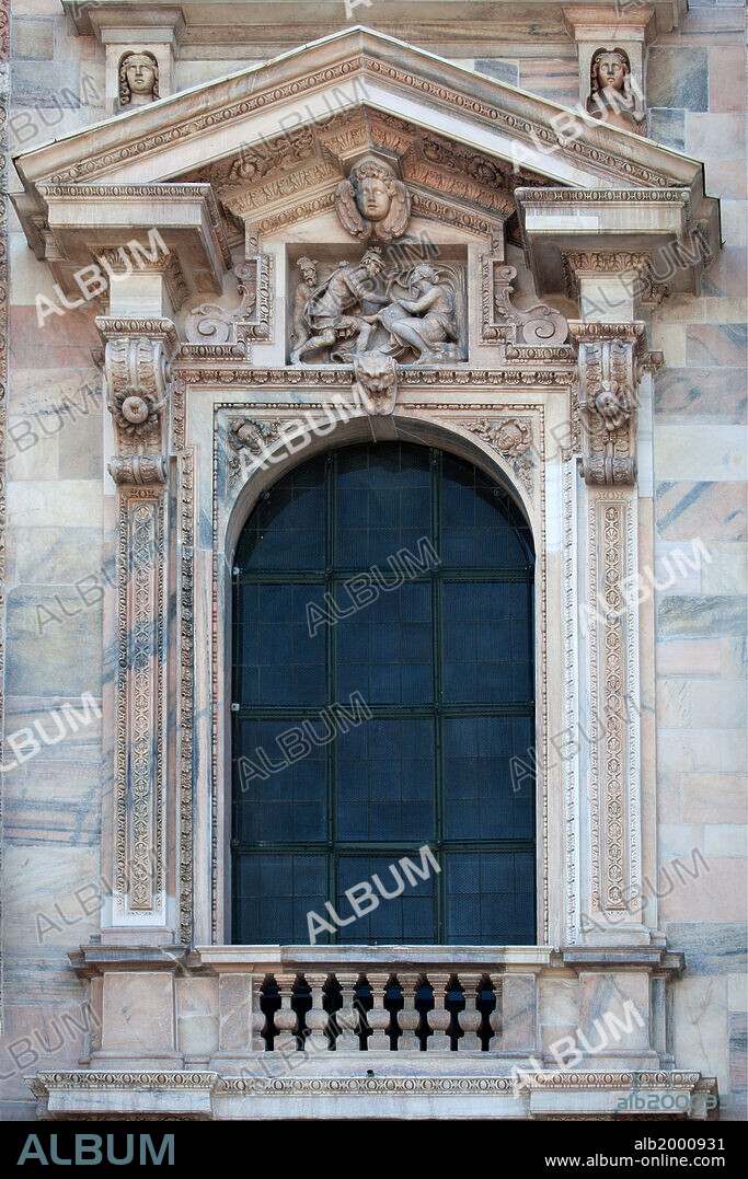 Italy, Milan, Milan Cathedral, Windows. The Cathedral of Milan is in Gothic and neo-Gothic style, for the Gothic west front was begun in 1616 and completed just 200 years later. From 1900 some of the less Gothic details of the facade were replaced in a true Gothic style, to designs of Giuseppe Brentano. The composite style is the result of many stages of decoration and construction, spanning more than three centuries, starting from the 16th century.