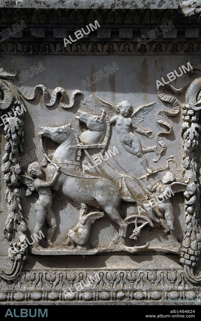 Ostia Antica. Sacellum. Altar of the Twins. Relief depicting Cupid carrying the chariot of Mars. Italy.