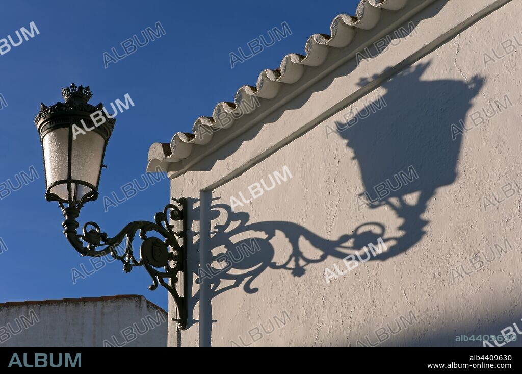 Streetlight and shadow, Alosno, Huelva province, Region of Andalusia, Spain, Europe.