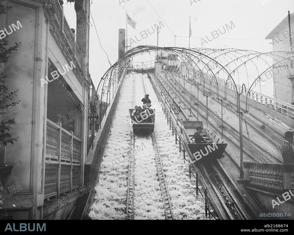 Waterslide enthusiast rides rails on Coney Island Amusement Park.