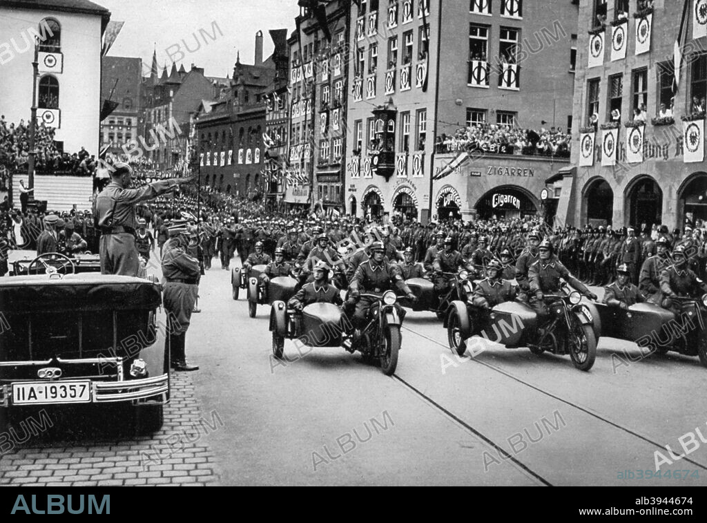 Adolf Hitler reviewing motorcycle troops at the Nuremberg Rally ...