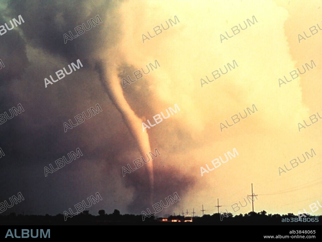 A tornado is a violent, dangerous, rotating column of air that is in contact with both the surface of the earth and a cumulonimbus cloud or, in rare cases, the base of a cumulus cloud. They are often referred to as a twister or a cyclone, although the word cyclone is used in meteorology in a wider sense, to name any closed low pressure circulation. Tornadoes come in many shapes and sizes, but are typically in the form of a visible condensation funnel, whose narrow end touches the earth and is often encircled by a cloud of debris and dust. Most tornadoes have wind speeds less than 110 miles per hour (177 km/h), are approximately 250 feet (80 m) across, and travel a few miles (several kilometers) before dissipating. The most extreme tornadoes can attain wind speeds of more than 300 mph (480 km/h), stretch more than two miles (3 km) across, and stay on the ground for dozens of miles (more than 100 km).The first tornado captured by the NSSL doppler radar and NSSL chase personnel. The tornado is here in its early stage of formation. Union City, Oklahoma May 24, 1973.