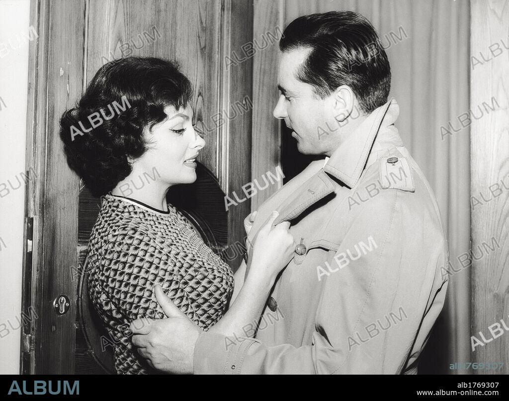 Gina Lollobrigida with her husband Milko Skofic. Italian actress Gina Lollobrigida embracing her husband Milko Skofic, Slovenian doctor, in their residence on the Appian way. Rome, January 1958.