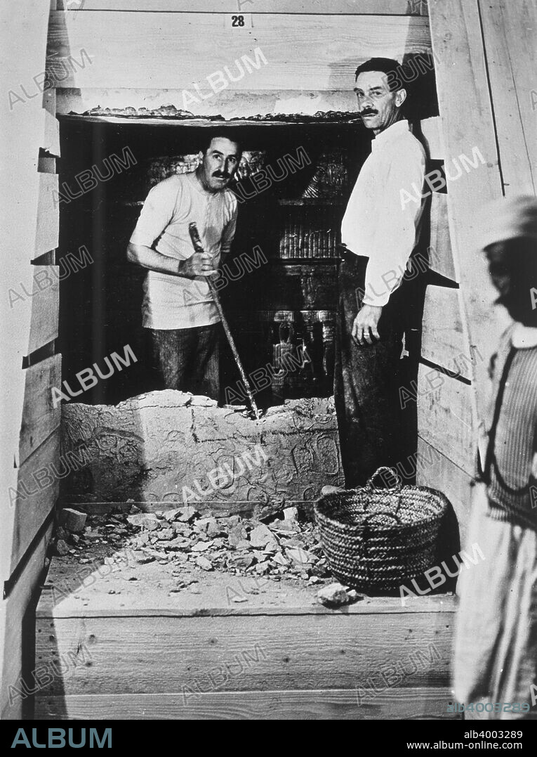 Howard Carter and a colleague excavating a tomb in the Valley of