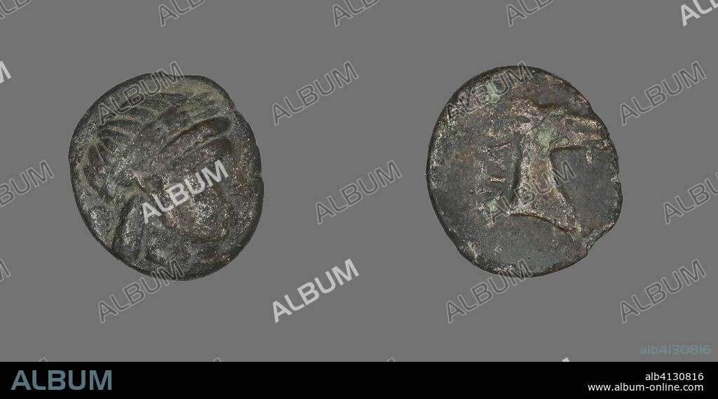 ANCIENT GREEK. Coin Depicting the God Apollo. Greek. Date: 300 BC-201 BC. Dimensions: Diam. 1.8 cm; 3.12 g. Bronze. Origin: Ancient Greece.