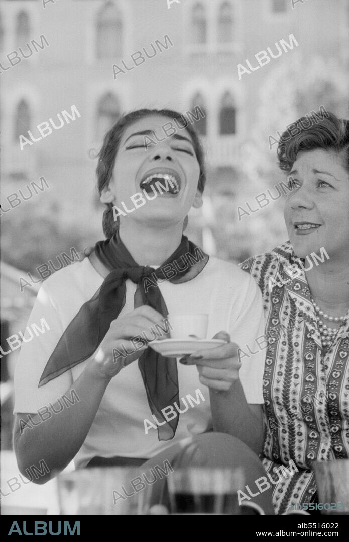 Greek soprano Maria Callas (Anna Maria Cecilia Sophia Kalogeropoulou) laughing with a cup of coffee next to Italian countess Anna di Castelbarco during the XVIII Venice International Film Festival. Venice, 1957 (Credit Image: © Mario De Biasi/Mondadori Portfolio via ZUMA Press).