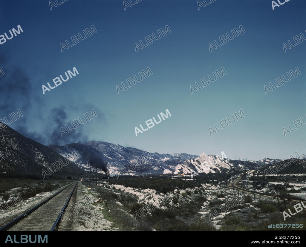 JACK DELANO. Freight train going up Cajon Pass through the San Bernardino Mountains, Cajon, Calif.