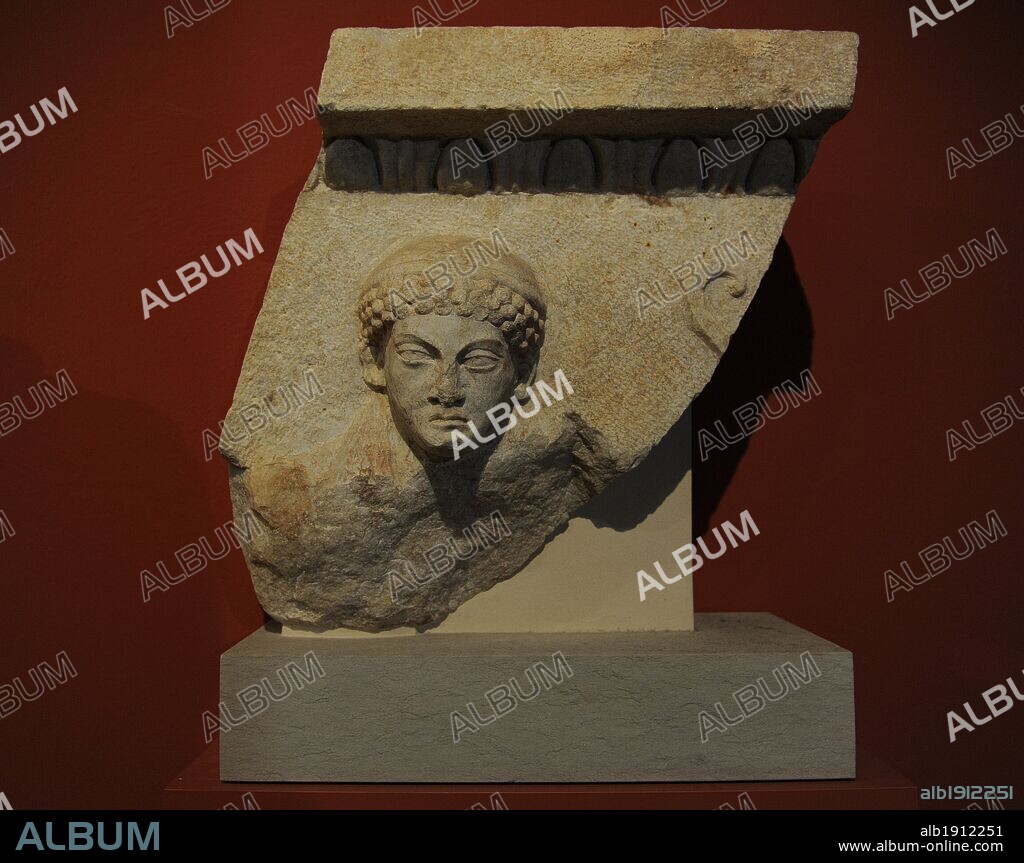 Fragment of the coffered ceiling slab of the porch with relief depicting god Apollo with archaistic bulging curly hair-style. From the Temple of Sarapis. Marble. 200 AD. Miletus. Pergamon Museum. Berlin. Germany.