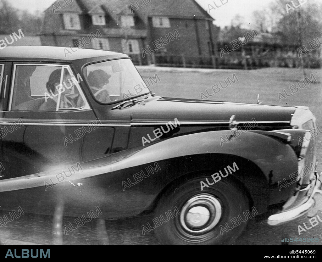 H.M. The Queen drives her car while at Windsor. The passengers are