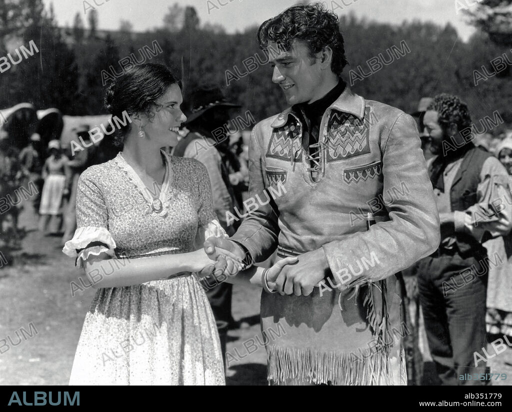 JOHN WAYNE et MARGUERITE CHURCHILL dans THE BIG TRAIL, 1930, réalisé par RAOUL WALSH. Copyright FOX FILMS.