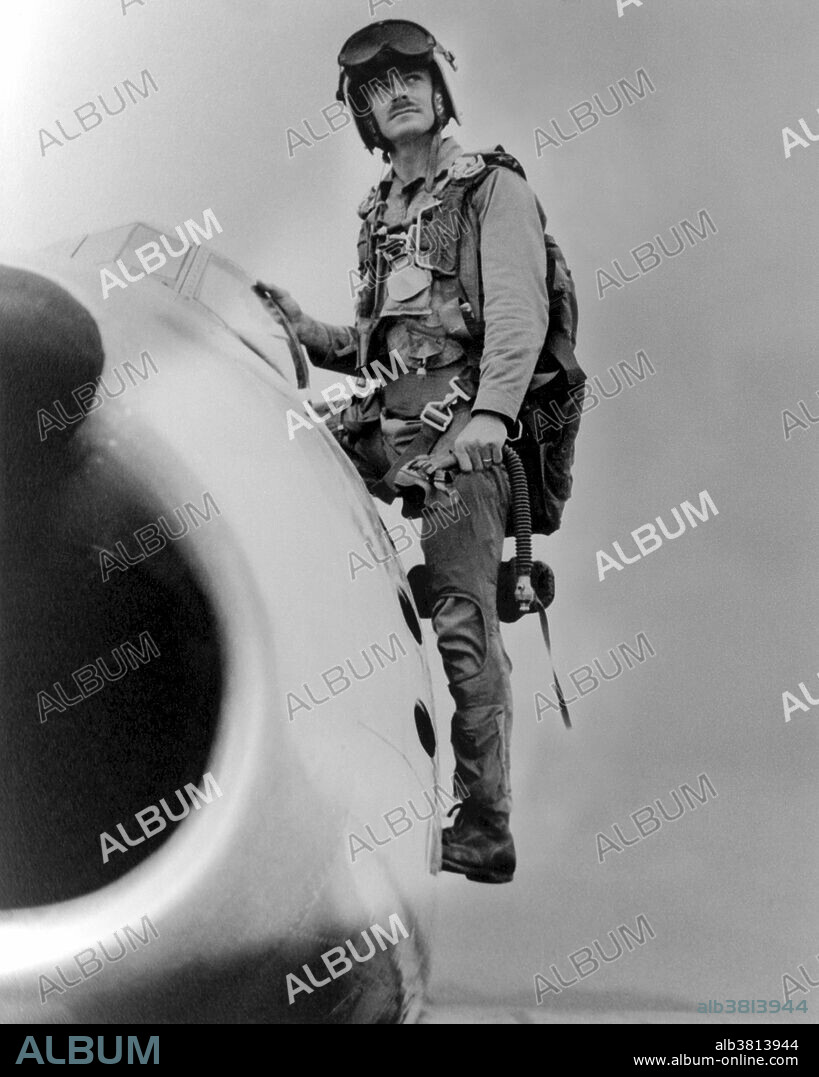 Caption: " US Marine Corps Major John F. Bolt, assigned to the 1st Marine Aircraft Wing, as he exits his USMC F-86 "SABER" jet aircraft." John Franklin Bolt (May 19, 1921 - September 8, 2004) was a USMC aviator and a decorated flying ace who served during WW II and the Korean War. He remains the only US Marine to achieve ace status in two wars and rose to the rank of lieutenant colonel during his military career. He was also the only Marine jet fighter ace. In 1941, he joined the Marine Corps, was sent to the Pacific Theater of Operations, where he flew an F4U Corsair during campaigns in the Marshall Islands and New Guinea, claiming six victories against Japanese A6M Zeroes. During the Korean War he led flights of F-86 Sabres into combat with MiG-15s of the Chinese Air Force, scoring six victories during fights along the northern border of North Korea, commonly known as "MiG Alley," giving him a total of 12 victories over his career. He stayed in the Marine Corps until 1962, serving as an analyst and instructor, before retiring. He died from leukemia in 2004 at the age of 84.