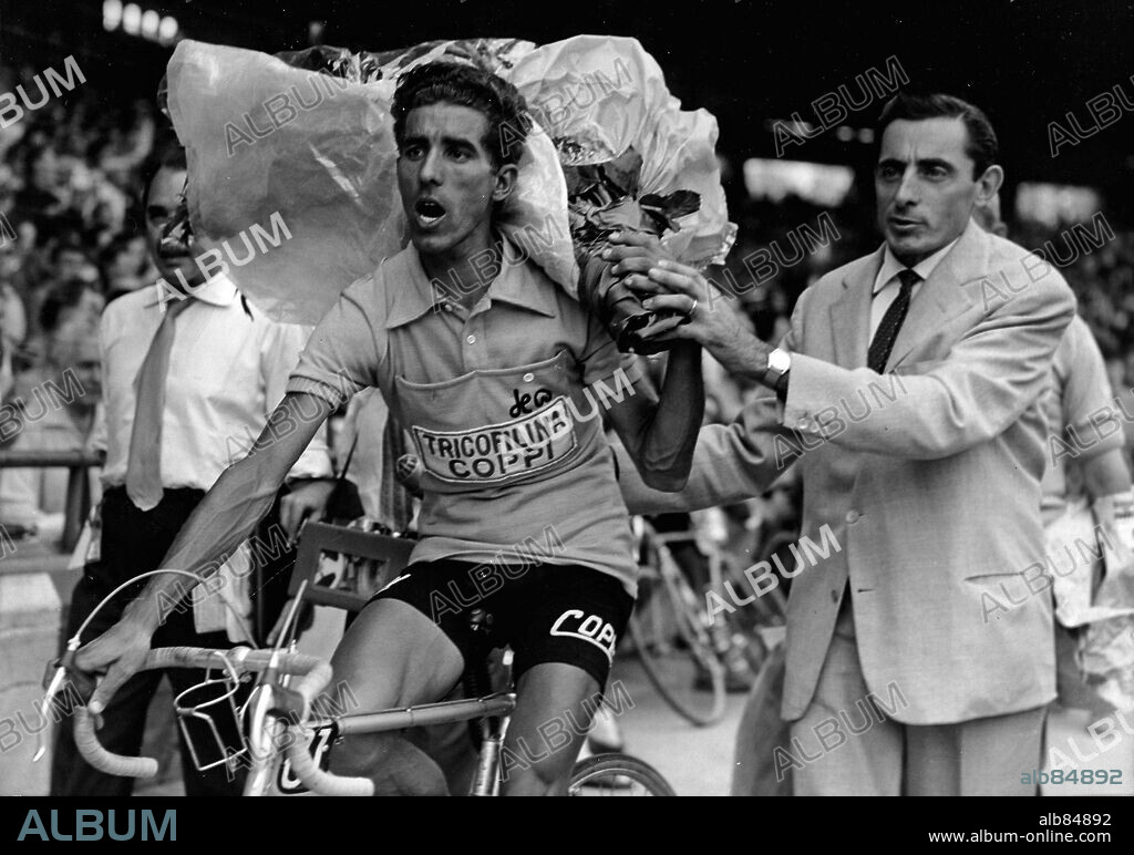 Jul 18, 1959-Paris, France- (File Photo) ANGELO FAUSTO COPPI was an Italian racing cyclist. Nicknamed 'Il Campionissimo' (Champion of the Champions) he was one of the most successful and most popular cyclists of all time. He twice won the Tour de France (1949 and 1952), and five times the Giro d'Italia (1940, 1947, 1949, 1952, 1953). PICTURED: ANGELO FAUSTO COPPI, right, manager of 1959 Tour de France winner FEDERICO BAHAMONTES, left, in the Parc des Princes velodrome after the finish the finish of the. 18/07/1959