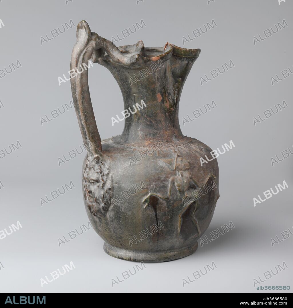 Terracotta jug. Culture: Roman. Dimensions: 8 9/16in. (21.8cm)
Other: 5 7/16in. (13.9cm). Date: 2nd half of the 1st century B.C..
Trefoil mouth and grotesque human figures in relief.