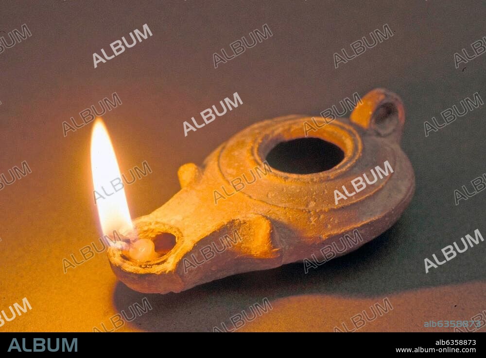 2641. LIGHTED HERODIAN OIL LAMP.