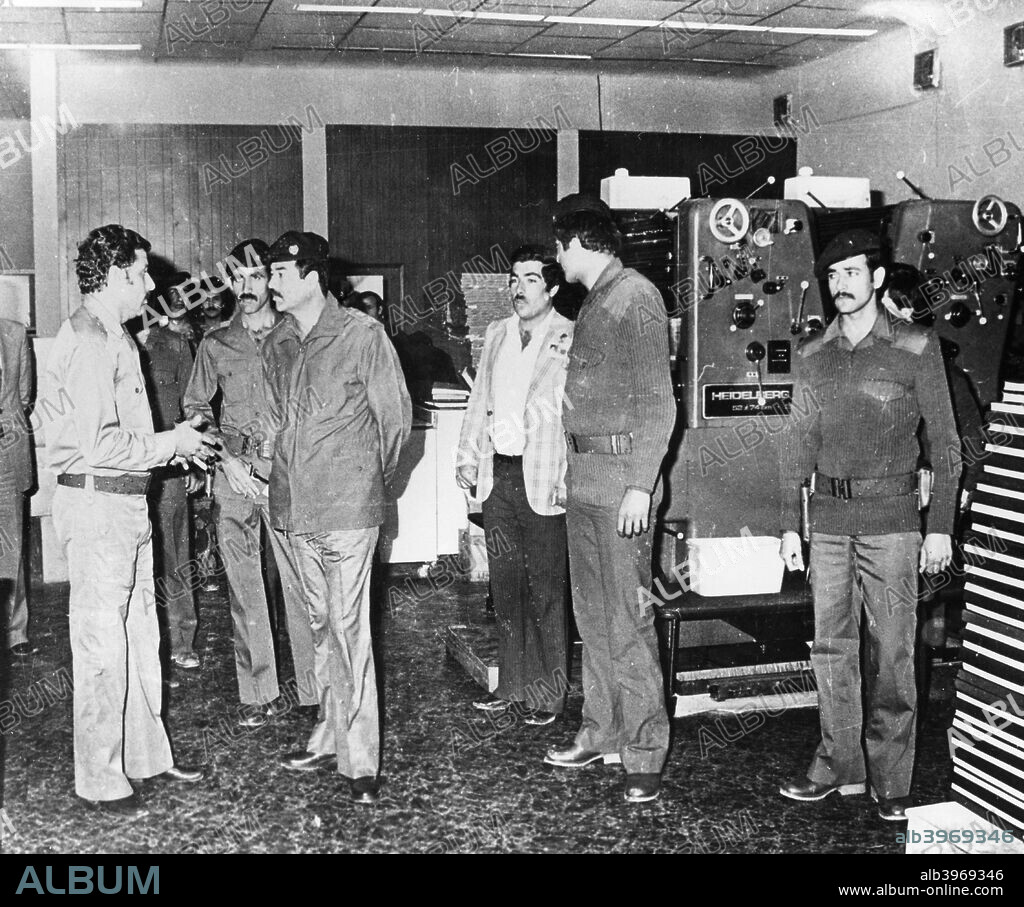 Saddam Hussein visiting a state paper press, Baghdad, Iraq, 1986.