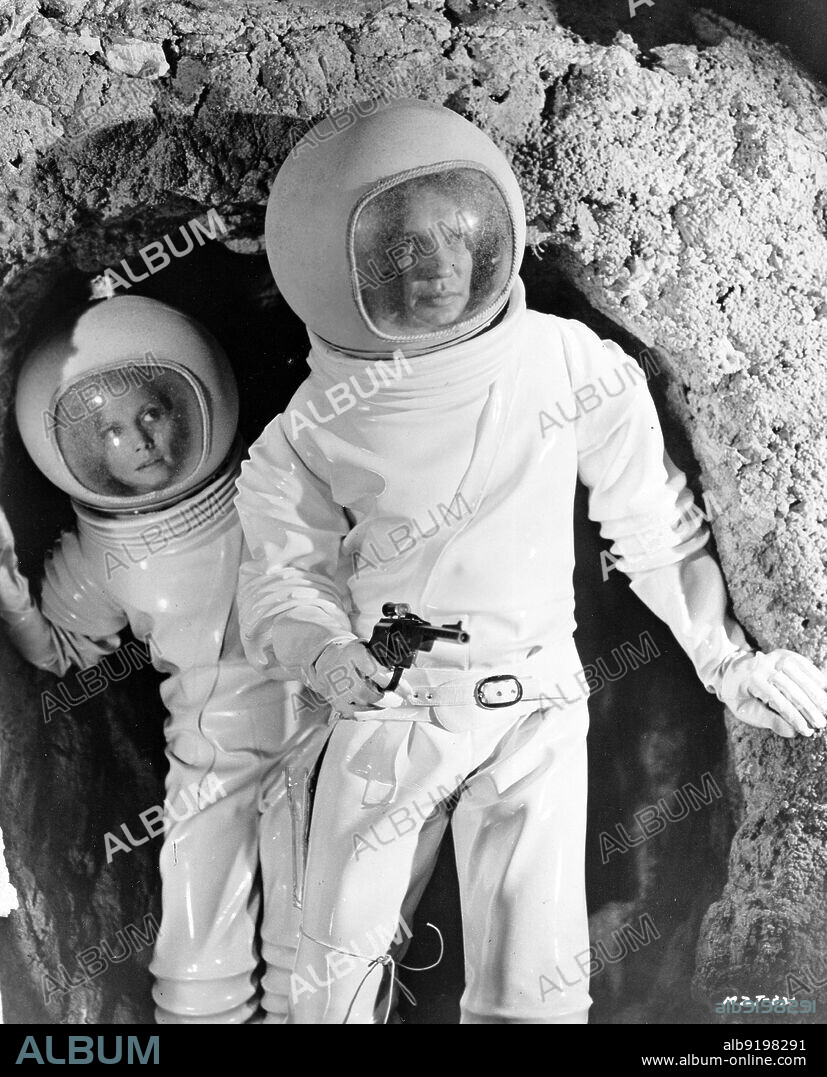 CATHERINE SCHELL and JAMES OLSON in MOON ZERO TWO, 1969, directed by ROY WARD BAKER. Copyright HAMMER/WARNER BROTHERS.