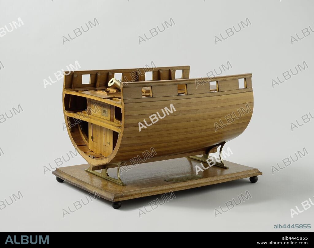 Model of the Mortar Bed of a Bomb Demolition, Model of the cross-section of a ship, on which the construction of the support of a mortar rack is indicated twice, on a standard on a floorboard. On one side the construction is fully worked out and can be taken apart completely, on the other side it is only partly shown. The ship has two decks, under each mortar rack there are five cat tracks in the hold, going from one side to the other under the deck beams of the lower deck. In the longitudinal direction two walls are arranged of stacked beams, connected by dovetail tails, which support the upper deck. The finished part is also completely filled with beams and struts, which creates two cupboards in the hold, the whole finished with a large number of added metals and artificial knees. This part is also detailed with the mortar on her affuit à pivot. Parts of the deck must be removed for the pivot to turn. The mortar is 6.8 cm long and has a 15 mm caliber. The other part, not worked out, is provided with the hood with which the gun is covered. A hatch with grates has been fitted between the two mortar racks. The model has four gun ports on each side. 1:20 scale (according to Obreen), Hekla (ship), Medusa (ship), Proserpina (ship), Rijkswerf Rotterdam, Rotterdam, c. 1842 - c. 1847, wood (plant material), brass (alloy), iron (metal), model: h 47 cm × w 72.5 cm × d 50 cm packaging capsule: h 56 cm × w 79.5 cm × d 55 cm.