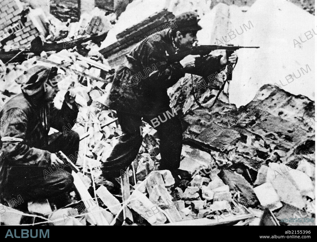 Warsaw uprising, poland, 1944, world war 2, polish partisans in a fire fight with nazi soldiers on the streets of war-torn warsaw. 01/02/2013