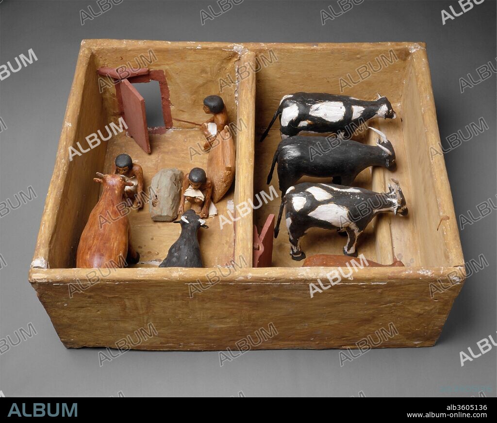 Model Cattle stable from the tomb of Meketre. Dimensions: l. 72.5 cm (28 9/16 in); w. 57 cm (22 7/16 in); h. 28.5 cm (11 1/4 in)
average height of cattle: 18 cm (7 1/16 in.). Dynasty: Dynasty 12. Reign: reign of Amenemhat I, early. Date: ca. 1981-1975 B.C..
This model of a stable was found with twenty three other models of boats, gardens, and workshops in a hidden chamber at the side of the passage leading into the rock cut tomb of the royal chief steward Meketre, who began his career under King Nebhepetre Mentuhotep II of Dynasty 11 and continued to serve successive kings into the early years of Dynasty 12.
Cattle are being fattened for slaughter in this stable. Four oxen feed from a manger in the large stall; two others are being hand fed by the stablemen from a pile of fodder and a sack of grain in the room in front. One of the cattle is so fat he can no longer stand. By the door sits an overseer with a baton in his hand.
All the accessible rooms in the tomb of Meketre had been robbed and plundered already during Antiquity; but early in 1920 the Museum's excavator, Herbert Winlock, wanted to obtain an accurate floor plan of the tomb's layout for his map of the Eleventh Dynasty necropolis at Thebes and, therefore, had his workmen clean out the accumulated debris. It was during this cleaning operation that the small hidden chamber was discovered, filled with twenty-four almost perfectly preserved models. Eventually, half of these went to the Egyptian Museum, Cairo, and the other half came to the Metropolitan Museum in the partition of finds.