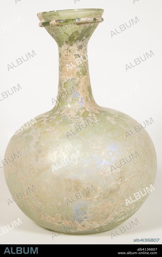 ANCIENT ROMAN. Flask. Roman. Date: 301 AD-400 AD. Dimensions: 26.7 × 19.6 × 19.6 cm (10 1/2 × 7 3/4 × 7 3/4 in.). Glass. Origin: Syria.