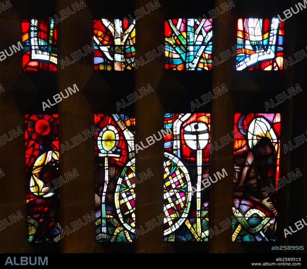 Stained glass windows designed by john Piper depict the light of god, at the New St Michael's Cathedral, Coventry.