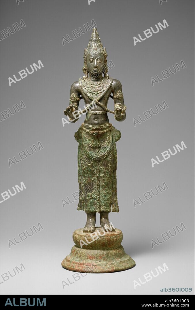 Bodhisattva, probably Avalokiteshvara. Culture: Sri Lanka. Dimensions: H. (with pedestal): 11 1/2 in. (29.2 cm); W. 2 3/4 in. (7 cm); D. 3 5/8 in. (9.2 cm). Date: ca. 8th century.
Mahayana Buddhism once flourished in Sri Lanka, alongside Theravada Buddhism, as witnessed by this bejeweled bodhisattva.