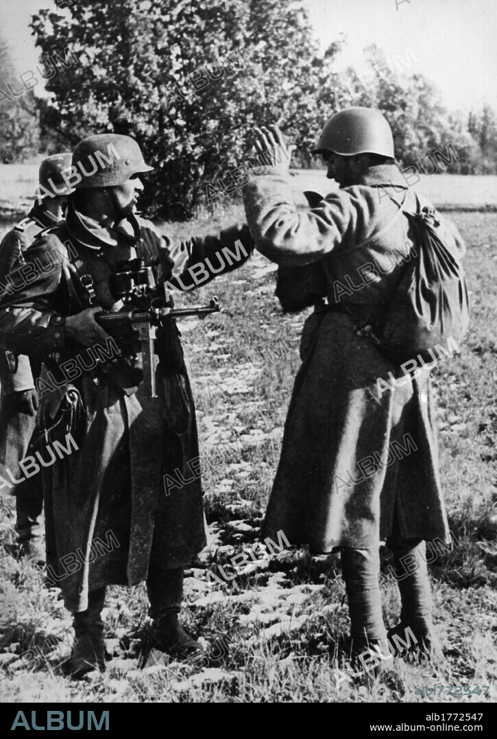 German patrol capturing Russian scout. A German patrol in action in the Moscow area searching a captured Soviet soldier. Moscow, October 1941.