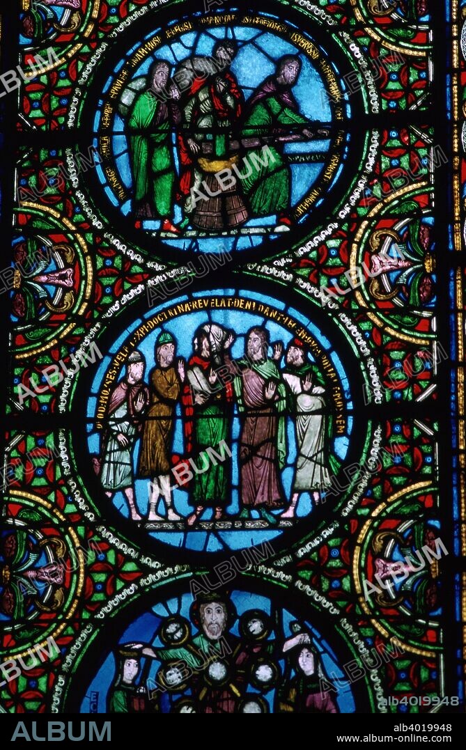 Detail of a stained glass window in St Denis, France, 12th century.