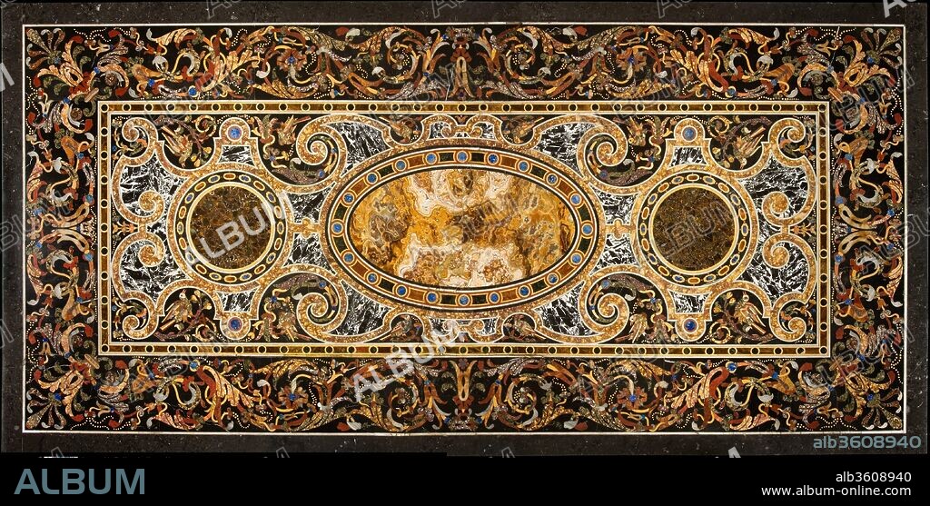 Pietra dura table top. Culture: Italian, Rome. Dimensions: Overall (confirmed): 94 1/8 × 45 1/8 × 4 in., 1926 lb. (239.1 × 114.6 × 10.2 cm, 873.6279 kg);
Overall (confirmed, ht. and wt. of table assembled on non-original base): 35 3/4 × 94 1/8 × 45 1/8 in., 1926 lb. (90.8 × 239.1 × 114.6 cm, 873.6279 kg). Date: late 16th or early 17th century.
This magnificent hardstone (pietra dura) tabletop is notable for the geometric design and central alabaster oval flanked by roundels of marble (breccia di Tivoli). These features are typical of Rome in the years around 1600 and distinguish the tabletop from Florentine examples. Four lapis lazuli bolts hold in place the strapwork cartouches that recall forged iron. The severity of the inner decoration seems to translate jewelry designs from contemporary pattern books while the border of wild animals, blossoms emitting seeds like strings of pearls, leafy scrollwork and floral sprays includes motifs derived from ancient Roman mosaics.