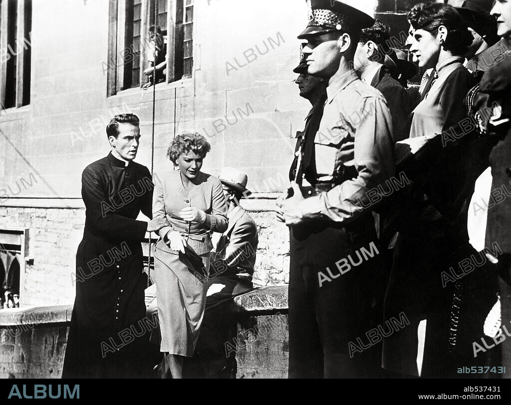 ANNE BAXTER and MONTGOMERY CLIFT in I CONFESS, 1953, directed by ALFRED HITCHCOCK. Copyright WARNER BROTHERS.