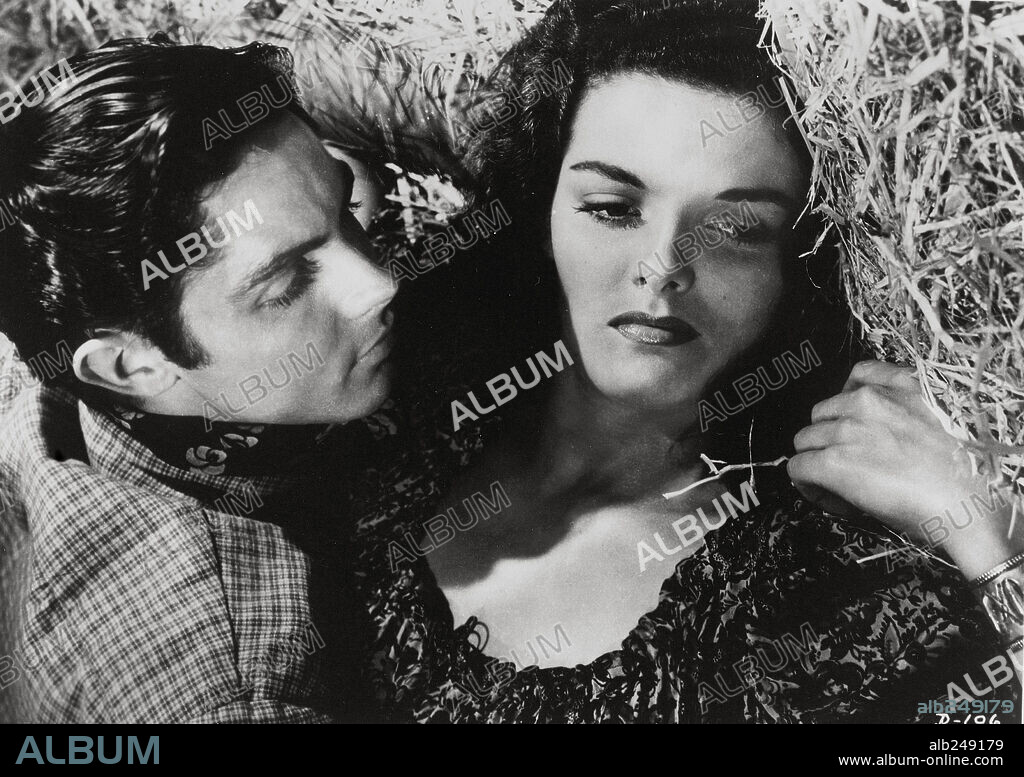 JACK BUETEL and JANE RUSSELL in THE OUTLAW, 1943, directed by HOWARD HUGHES. Copyright RKO.