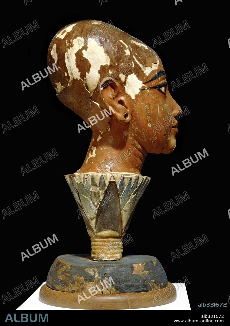 Young Pharaoh Tutankhamun portrait head in lotus leaf painted wood 20th dynasty treasure of Tutankhamun.