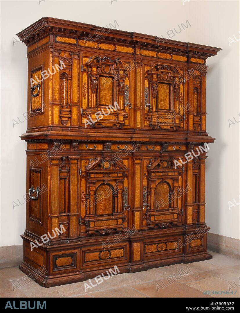 Cabinet (Fassadenschrank). Culture: German, Nuremberg. Dimensions: Overall: H. 104 x W. 84 x D. 30 1/4 in. (264.2 x 213.4 x 76.8 cm); 
Field measurement: H. 102 5/8 x W. 89 1/4 x D. 28 1/2 in. at mid-height (cornice wider). Date: early 17th century.
During the sixteenth and seventeenth centuries in Central Europe, the term "woodworker" did not define a single trade. Instead, there were cabinetmakers and chairmakers, each represented by their own guild. The lathe-turned parts of wooden furniture could not be made in the shop but had to be bought from members of an independent turners' guild and the hardware ordered from a master blacksmith. This complex system had been developed to protect guild members from outside competition and to guarantee them a minimum wage. Each master--that is, each qualified member of a guild--was allowed to employ only two journeymen and one or sometimes two apprentices. Only the artisans who worked for one of the many courts of the scattered German territorial states were exempt from these regulations.[1]
Apprentices in the extremely conservative cabinetmakers' guild were required to create a masterpiece, or chef d'oeuvre, of highly complicated design in order to qualify as a master. The guilds in different German towns--from the free imperial cities of Augsburg and Nuremberg in southern Germany to the urban strongholds of the Hanseatic League in the north--had diverse requirements for masterpieces. Nor were all the candidates for mastership in a given guild treated equally in this respect. A "foreign" journeyman--and in the patchwork configuration of states in the Holy Roman Empire, that might mean a man born a stone's throw from the boundary lines of the region under a guild's control--often had to produce a more elaborate and costlier masterpiece than a local applicant for membership. A guild member's son or son-in-law or the prospective husband of a master's widow, all of whom were likely to acquire an already established workshop, were also assigned an easier task.[2] The cabinet piece not only had to demonstrate the design skills of the journeyman and his acquaintance with the architectural theory of the period[3]--for the practice of imitating architecture in furniture was widespread in Germany--but also had to show his mastery of joinery. Sometimes the assignment even included producing a simple structure, such as a window frame. The candidates had to invest money to buy the materials they needed and were unable to earn anything during the time they spent working on the piece. In most cases they were forced to sell their high-quality masterpiece immediately after presenting it to the aldermen of the guild, in order to pay city taxes, to cover entrance contributions to various guild funds, and to raise capital to establish their own business.
We do not know if the Museum's splendid cupboard was a masterpiece; certainly it represents a tour de force of cabinetmaking. This type of cupboard with an architectural front (hence its German name, Fassadenschrank--literally, "facade cabinet") became popular in Germany during the late Gothic period. The Museum's example clearly reflects Italian Renaissance palace architecture of the sixteenth century. Certain carved elements on the pediments and in the niches and also the hardware ornaments indicate that it should be dated to the early seventeenth century, although its form in general would suggest the period between 1550 and 1575. It consists of a drawer-podium supporting a two-door cabinet, and at the top a hollow cornice. The form developed from the simple idea of placing two similar chests on top of each other to create an optical unit.[4] Characteristic details are the heavy wrought-iron handles, two on each side, which made it possible to dismantle the object quickly in case of fire.[5]
The cupboard's majestic appearance derives from its balanced proportions, and its visual interest lies in architectural details such as the projecting and recessed components of the front and the use of woods of different colors and grain, which evoke the marble slabs on Renaissance facades.[6] When new, these woods must have offset each other to an even more striking effect. Unusual is the pretzel shape of the handles.
Large cupboards were often built to contain a bride's linens. The long pine shelves of this one are marked with numbers (from one through thirty-one) to indicate exactly where rolls of fabric or folded items should be placed.[7]
This Fassadenschrank and a related cupboard were among the first pieces of Central European furniture to enter the Metropolitan Museum, and they remain the most important examples of their type in North American museums.[8]
[Wolfram Koeppe 2006]
Footnotes:
[1] Michael Stürmer. "'Bois des Indes' and the Economics of Luxury Furniture in the Time of David Roentgen." Burlington Magazine 120 (December 1978), p. 800; Michael Stürmer. Handwerk und höfische Kultur: Europäische Möbelkunst im 18. Jahrhundert, Munich, 1982; Michael Stürmer. Herbst des alten Handwerks: Meister, Gesellen und Obrigkeit im 18. Jahrhundert. Serie Piper 515. Munich, 1986; Christopher Wilk, ed. Western Furniture, 1350 to the Present Day, in the Victoria and Albert Museum, London. London, 1996, pp. 84, 98 (entries by Sarah Medlam; the two German cabinets she discusses are eighteenth-century; however, the guild situation had not changed since the late medieval period).
[2] Douglas Ash. "Gothic." In World Furniture: An Illustrated History, ed. Helena Hayward, pp. 26-24. New York, 1965, p. 34, fig. 86; Hans Huth. "Renaissance: Germany and Scandinavia." In World Furniture: An Illustrated History, ed. Helena Hayward, pp. 47-52. New York, 1965, p. 48, fig. 136 (dated 1541); Peter Wilhelm Meister. "The Eighteenth Century: Germany." In World Furniture: An Illustrated History, ed. Helena Hayward, New York, 1965, p. 146, fig. 572; Heinrich Kreisel. Die Kunst des deutschen Möbels: Möbel und Vertäfelungen des deutschen Sprachraums von den Anfängen bis zum Jugendstil. Vol. I, Von den Anfängen bis zum Hochbarock. Munich, 1968, pp. 74-76, 180-85, figs. 91, 93, 101, 142-51, 389, 390; Wolfram Koeppe. "Vergessene Meisterwerke deutscher Möbelkunst: Die Meisterstücke der Breslauer Schreinerzunft im 18. Jahrhundert." Kunst & Antiquitäten, 1991, no. 4, pp. 38-45; Wolfram Koeppe. Die Lemmers-Danforth-Sammlung Wetzlar: Europäische Wohnkultur aus Renaissance und Barock. Heidelberg, 1992, pp. 118, 157-59, 162-64, 168, 192-94, nos. M52, M88, M92, M97, color ills. pp. 190, 192, 242; and John Morley. The History of Furniture: Twenty-five Centuries of Style and Design in the Western Tradition. Boston, 1999, p. 74, fig. 129.
[3] The ten-part treatise De Architectura (after 17 B.C.) by the Roman architect Vitruvius Pollio was very influential. It had been reissued in Latin in 1485 in Rome by Giovanni Sculpicio. One of the best-known editions north of the Alps was Sebastiano Serlio's treatise Regole generali di architettura sopra le cinque maniere de gli edifici published in 1537 in Venice and translated into German in 1542; Hubertus Günther. Deutsche Architekturtheorie zwischen Gotik und Renaissance. With contributions by Michael Bode et al. Darmstadt, 1988. Another important German translation of Vitruvius's De Architectura, with added illustrations, was Vitruvius Teutsch by Walther Hermann Ryff (Rivius) of Nuremberg (ca. 1500-after 1545), published in 1548. Ryff, who added his own commentary, dedicated the work "to all artistic craftsmen, foremen, stonecutters, builders, headgear makers and gunsmiths,...painters, sculptors, goldsmiths, cabinetmakers, and all who have to use the compass and the guiding ruler in an artistic manner." Thus, Ryff intended his publication not for a small circle of humanist connoisseurs but for practicing craftsmen, including the makers of fine furniture; see Ingrid Dann. "Walther Ryff." In Hubertus Günther. Deutsche Architekturtheorie zwischen Gotik und Renaissance. With contributions by Michael Bode et al. Darmstadt, 1988, pp. 79-88, especially p. 81.
[4] Franz Windisch-Graetz. Möbel Europas von der Romanik bis zur Spätgotik. Munich, 1982, p. 265, no. 238; Wolfram Koeppe. Die Lemmers-Danforth-Sammlung Wetzlar: Europäische Wohnkultur aus Renaissance und Barock. Heidelberg, 1992, pp. 157-59, no. M88, color ill. p. 190.
[5] For similar cabinets, see Peter Wilhelm Meister and Hermann Jedding, eds. Das schöne Möbel im Laufe der Jahrhunderte. Heidelberg, 1958, fig. 101; Margrit Bauer, Peter Märker, and Annaliese Ohm. Europäische Möbel von der Gotik bis zum Jugendstil. Museum für Kunsthandwerk. Frankfurt am Main, 1976, figs. 17, 18 (the captions to these two illustrations are in reverse positions); Franz Windisch-Graetz. Möbel Europas: Renaissance und Manierismus, vom 15. Jahrhundert bis in die erste Hälfte des 17. Jahrhunderts. Munich, 1983, pp. 356-57, nos. 213, 294; and Wolfram Koeppe. Die Lemmers-Danforth-Sammlung Wetzlar: Europäische Wohnkultur aus Renaissance und Barock. Heidelberg, 1992, pp. 117-18, no. M52, color ill. p. 183.
[6] Erik Forssman. Säule und Ornament: Studien zum Problem des Manierismus in den nordischen Säulenbüchern und Vorlageblättern des 16. und 17. Jahrhunderts. Acta Universitatis Stockholmiensis. Stockholm Studies in History of Art I. Stockholm, 1956, pp. 39ff.
[7] The cabinet was restored in 1993-94 by John Canonico, Conservator, Department of Objects Conservation, Metropolitan Museum. Damaged shelves in the upper compartment have not been replaced.
[8] The accession number of the related cabinet is 05.22.1.