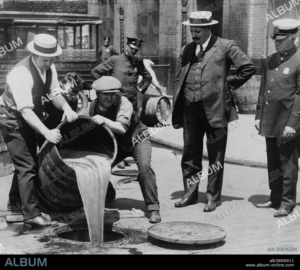 New York City Deputy Police Commissioner John A. Leach, right, watching agents pour liquor into sewer following a raid during the height of prohibition. Prohibition in the United States was a nationwide Constitutional ban on the sale, production, importation, and transportation of alcoholic beverages that remained in place from 1920 to 1933. It was promoted by dry crusaders movement, led by rural Protestants and social Progressives in the Democratic and Republican parties, and was coordinated by the Anti-Saloon League. Prohibition was mandated under the Eighteenth Amendment to the U.S. Constitution. Enabling legislation, known as the Volstead Act, set down the rules for enforcing the ban and defined the types of alcoholic beverages that were prohibited. Private ownership and consumption of alcohol was not made illegal under federal law; however, in many areas local laws were more strict, with some states banning possession outright. Prohibition supporters, called drys, presented it as a victory for public morals and health. Anti-prohibitionists, known as wets, criticized the alcohol ban as an intrusion of mainly rural Protestant ideals on a central aspect of urban, immigrant, and Catholic life. Nationwide Prohibition ended with the ratification of the Twenty-first Amendment, which repealed the Eighteenth Amendment, on December 5, 1933. Undated, no photographer credited.