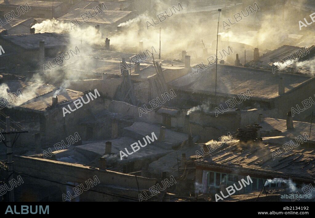 Air pollution from homes using coal stoves in Datong, Shanxi Province, China. (Photo by: Sovfoto/UIG via Getty Images).