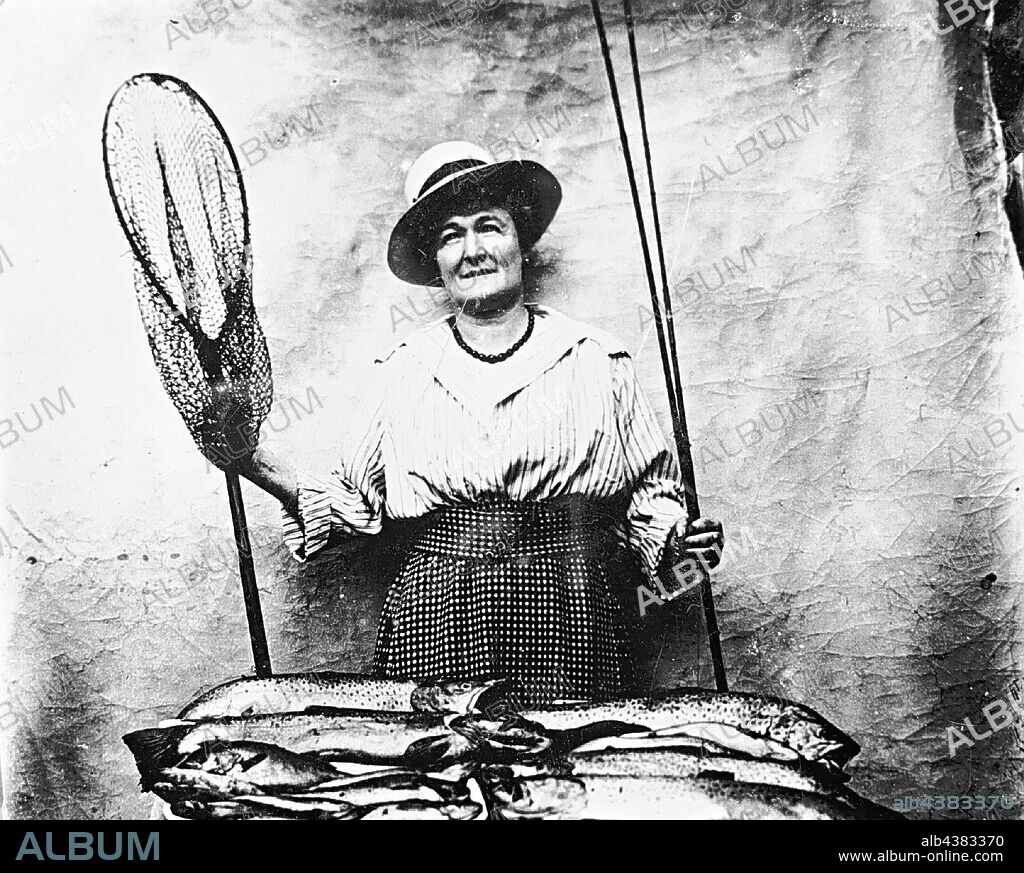 Negative - Woman With a Fishing Rod & Net Displaying her Catch