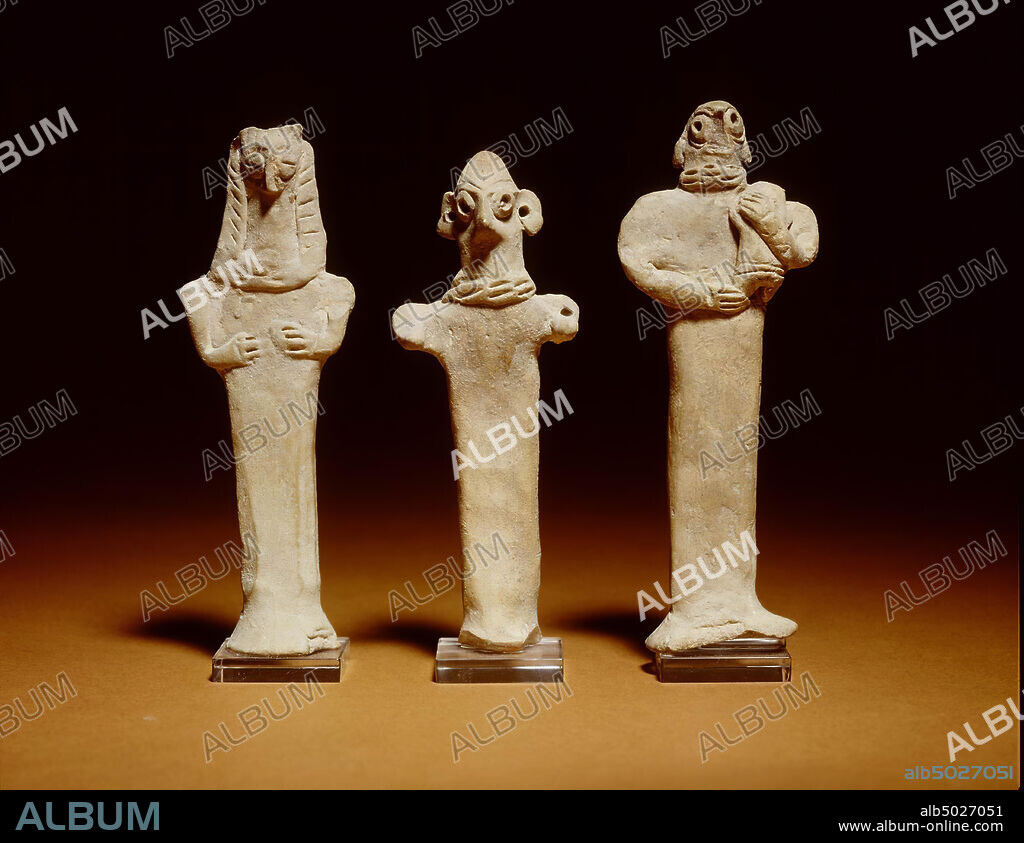 An earthenware statue of a human figure with an elongated and flattened ...