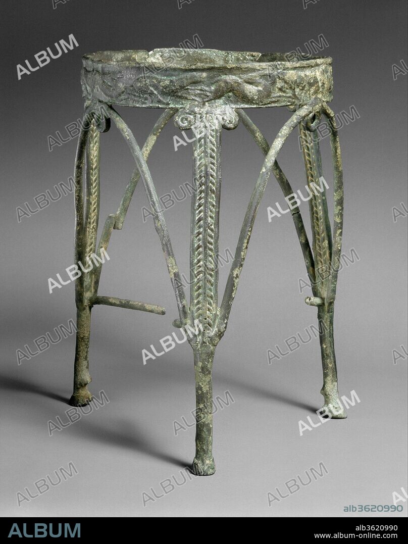 Bronze rod tripod. Culture: Cypriot. Dimensions: H. 14 3/4 in. (37.5 cm)
diameter of rim  9 3/4 in. (24.8 cm). Date: ca. 1250-1050 B.C..
Bronze tripods and other vessel stands from Cyprus represent some of the finest metalwork produced in the eastern Mediterranean at the end of the Late Bronze Age. Some were cast in one piece; others, such as this one, were composed of pieces cast or worked separately and fastened together by means of hard-soldering. The decoration shows a blend of Mycenaean Greek and Near Eastern elements. The stands themselves have a wide distribution, having been found on Cyprus, Crete, and the Cyclades, as well as in mainland Greece, Sardinia, and Italy. Ancient repairs to this stand's rim are one indication that it was a valuable, treasured item that may have been passed from one generation to another.