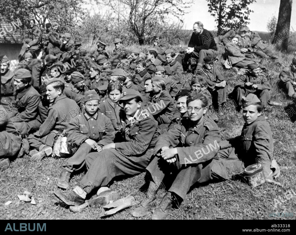 This is part of a group of 60 members of the Hitler youth organisation captured by the 14th Armoured Division, Third US Army, in the vicinity of Martizoll, Germany. Ranging in age from 13 to 17 years, they were handling machine guns.