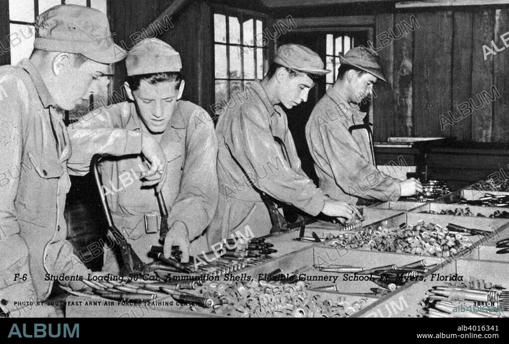 Students loading 50 cal ammunition shells, Flexible Gunnery School, Fort Myers, Florida, USA, 1943. Postcard.