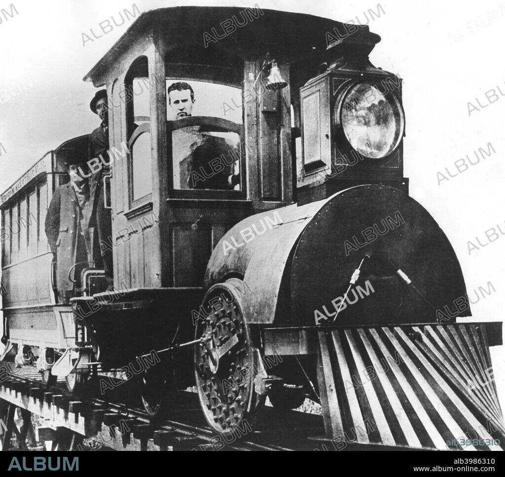 American inventor Thomas Alva Edison on board an electric railroad, 1892. Edison constructed a three-mile-long trial electric railroad at his Menlo Park laboratory in New Jersey.