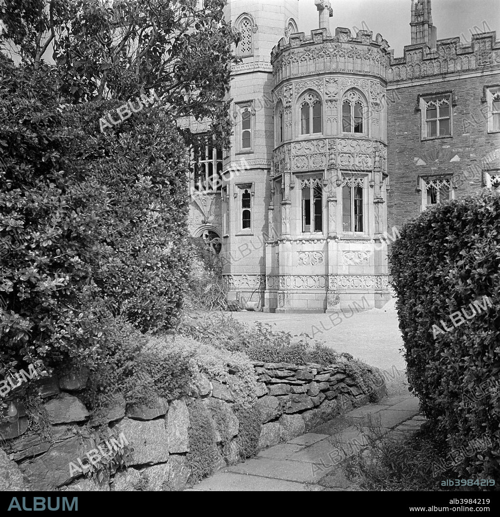 Place House, Fowey, Cornwall, 1945. Place House, next to the parish church in Fowey, was heavily remodelled in the early 19th century. Between 1813 and 1845, JT Treffry updated it in the Victorian Gothic style.