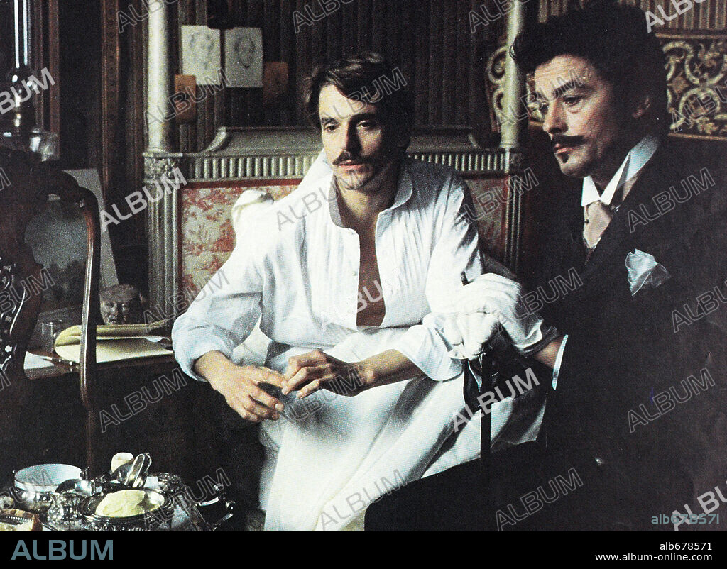 ALAIN DELON and JEREMY IRONS in SWANN IN LOVE, 1984 (UN AMOUR DE SWANN), directed by VOLKER SCHLONDORFF.