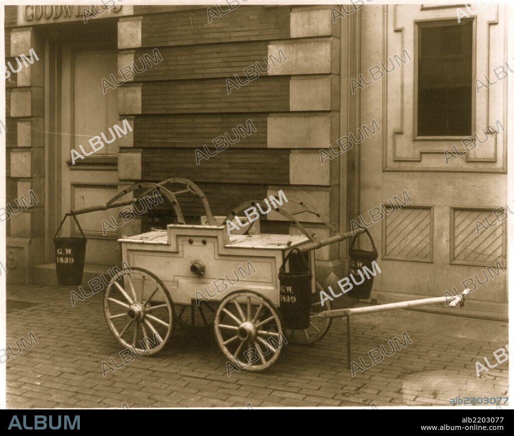 Small hand-drawn fire-engine, with 4 buckets on it, labeled G.W. 1839.