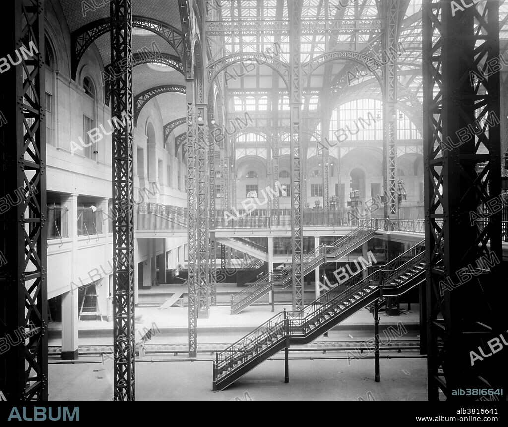 Track level and concourses. Pennsylvania Station was a historic railroad station, named for the Pennsylvania Railroad, its builder and original tenant, and shared its name with several stations in other cities. It was designed by McKim, Mead, and White and completed in 1910. The original Pennsylvania Station was considered a masterpiece of the Beaux-Arts style and one of the architectural jewels of New York City. Occupying two city blocks from Seventh Avenue to Eighth Avenue and from 31st to 33rd Streets, the original Pennsylvania Station building was 784 by 430 feet, covering an area of 8 acres. As rail usage declined in the 1950s, the Pennsylvania Railroad sold the air rights to the property and downsized the railroad station. The above ground head house and train shed of the station were demolished and replaced by Madison Square Garden and Pennsylvania Plaza between 1963 and 1969. The destruction of Pennsylvania Station galvanized support for architectural preservation across the United States, leading to the advent of modern historical preservation. Image from the Detroit Publishing Company circa 1910-1920.